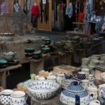 a table topped with lots of bowls and bowls